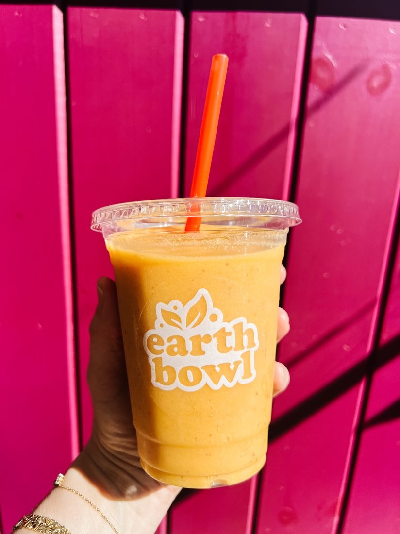 Mango shake against pink wall